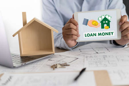 Real estate agent signing a contract over a house key  real estate  home loan