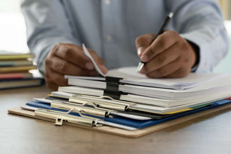 documents  paperwork stack of business paper documents on office on desk accounting paper fileの写真素材