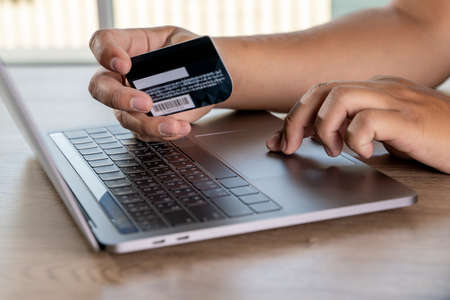 shopping and online payment credit card purchase online businessman mobile payment  on tableの写真素材