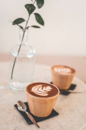 cup of coffee and coffee beans coffee cups in a cafeの写真素材