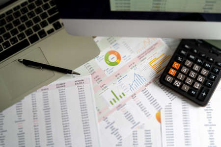 Accounting analysis businessman hand working Strategy Research analyzing financial data and charts