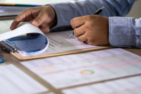 businessman working using a calculator finance accounting concept achievement to balance man...