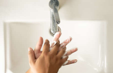 stop spreading coronavirus sanitizer  man Washing hands with soap man for corona virus pandemic hygieneの写真素材