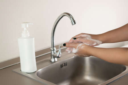 Woman washing hand for corona virus prevention Washing Hands stop spreading coronavirus Hygiene...