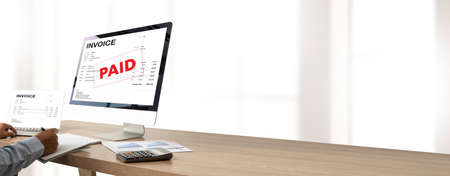 Invoices Payment Received Taxation Tax Businessman Calculating invoice document on computerの写真素材