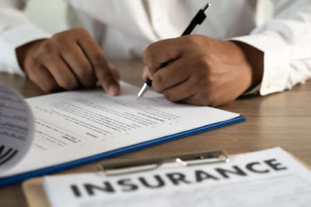 Concept of insurance man protective and car  family  health insurance  policy examiningの写真素材