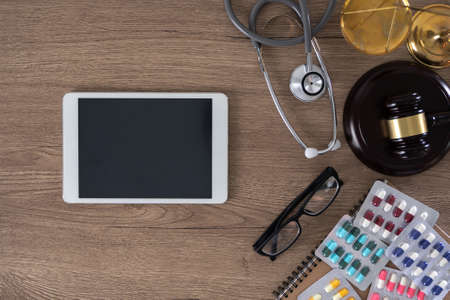 medical doctor writing prescription physician with stethoscope prescribing treatmentの写真素材