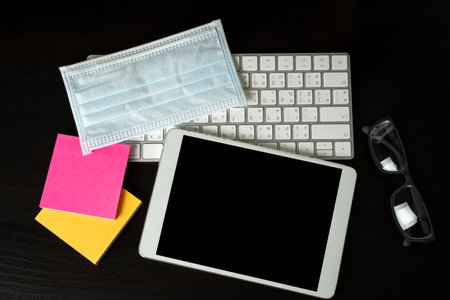 Coronavirus Covid-19 pandemic facemask on working financial Coronavirus pandemic socialの写真素材