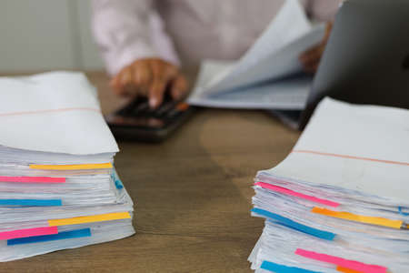 business administration and data documents on office desk, Stack of business overload paper.の写真素材