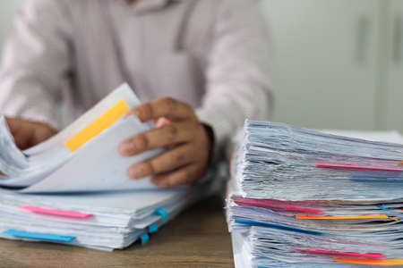 business administration and data documents on office desk, Stack of business overload paper.の写真素材