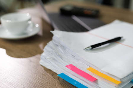 Stack of business paper Businessman working reading documents graph financial to job succes Analyze document plans documents on office deskの写真素材