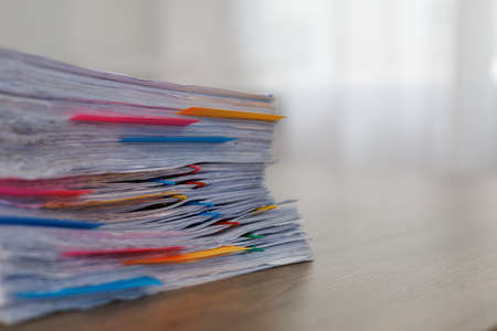 Stack of business paper Businessman working reading documents graph financial to job succes Analyze document plans documents on office deskの写真素材
