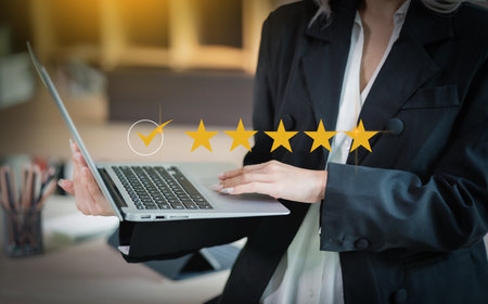 Asian beautiful businesswoman seriously working thinking idea for work on computer and think project for idea sitting work indoorの写真素材