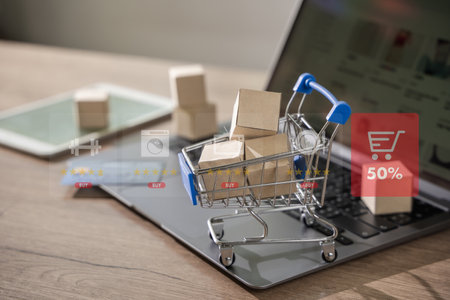 e-commerce marketing online shopping on a laptop Shopping and credit card payments for banking online, paper boxesの写真素材