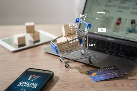 e-commerce marketing online shopping on a laptop Shopping and credit card payments for banking online, paper boxesの写真素材