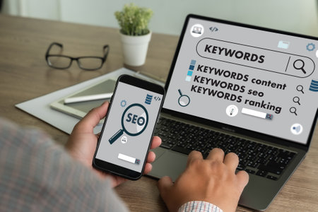 businessmanman search website for content keywords on laptop browse in office optimize seo engineの写真素材
