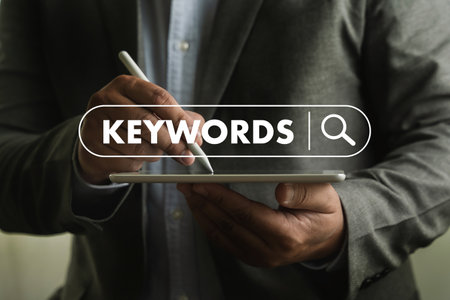 businessmanman search website for content keywords on laptop browse in office optimize seo engineの写真素材