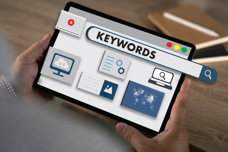 keywords on a website for content businessman Search keywords on a laptop, browse in the office, optimize SEO engine communication on the computer, find data analysis, and advertise on the internet.の写真素材