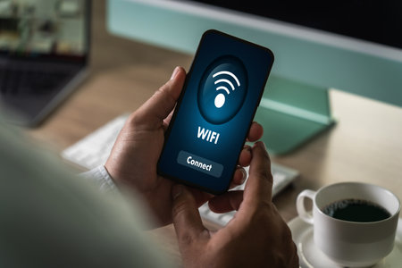 close-up man using smartphone with wifi icon communication social network button to connect to...
