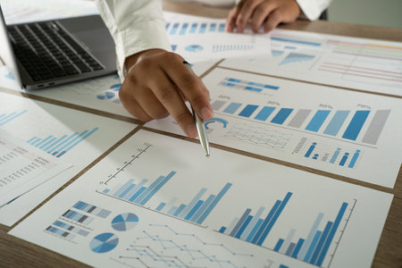 businessman working data document graph chart report chart suitable for financial investment analyzing financial and investment dataの写真素材