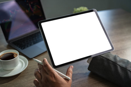 man hands hold computer tablet with isolated screen empty space frame mockup ONLINE ADVERTISING technology connection communication socialの写真素材
