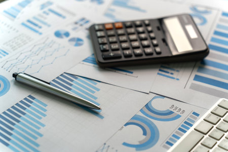 Close-up of the calculator paper data report Financial chart and pen document analysis budget chart finance accounting conceptの写真素材