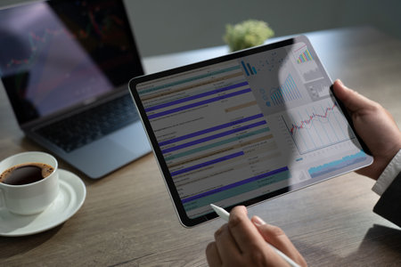 businessman professional working with digital tablet analyzing document strategy and chart professional strategy datum accounting tablet screenの写真素材