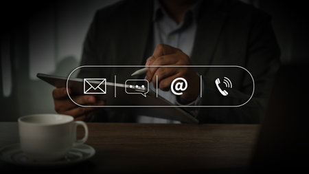 CONTACT US (Customer Support Hotline people CONNECT ) Businessman holding phoneonline customer...