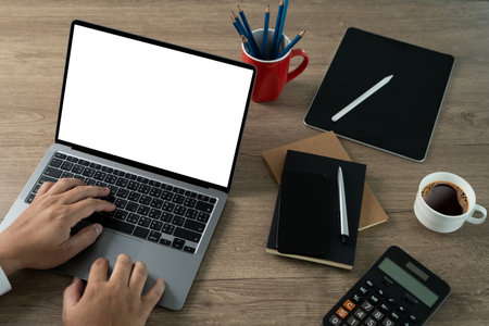 Closeup view Businessman analyze hand typing laptop computer with blank screen Business online, e commerceの写真素材