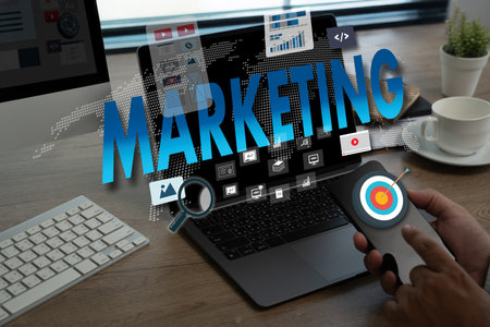 DIGITAL MARKETING new startup project MILLENNIALS Business team hands at work with financial reports and a laptopの写真素材