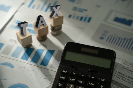 Calculation tax return Businessman calculating business balance prepare tax reduction.の写真素材