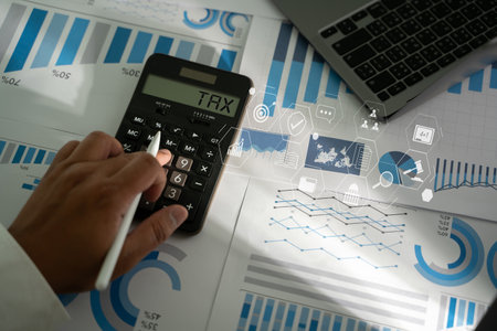Businessman calculating Accounting financial research Tax money deduction planning Income investment Statement. paying the tax rate document form paperworkの写真素材