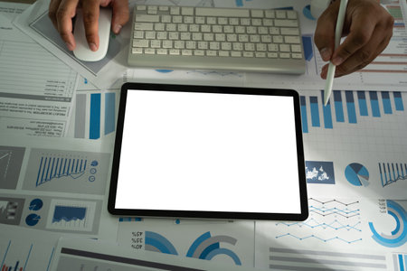 A businessman holds a mockup. iPad digital tablet with blank screen Mockup replaces your design...