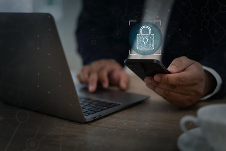 The businessman secures digital information with cyber technology, protecting online data and privacy through a safe network, a locked system, and strong passwords.の写真素材