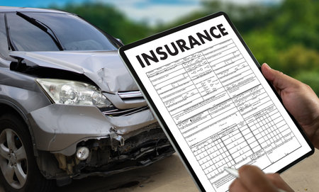 A car insurance policy guarantees financial protection for vehicle owners, covering risks, expenses, and legal agreements. An auto insurance agent helps clients with documentsの写真素材