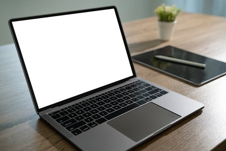Laptop with blank screen on table. Workspace background new project on laptop computer with blank copy space screen for your text messageの写真素材