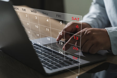 Booking Meeting Appointment Computer Online On digital tablet at office book appointmentの写真素材