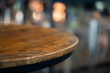 A wooden table with a black rim. The table is empty.の写真素材