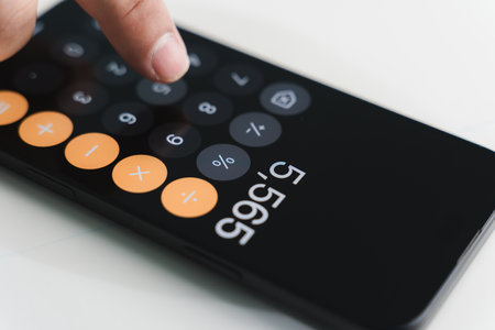 man accountant working on desk using calculator calculate while working analytic Accountingの写真素材