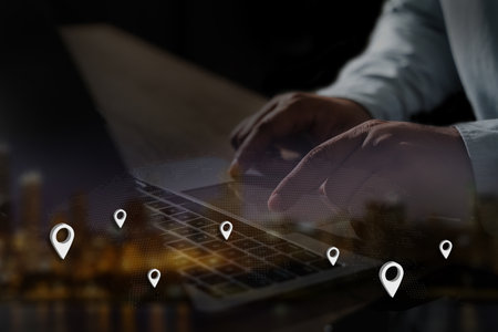 man using gps navigation on smartphone to route destination network connection location street mapの写真素材