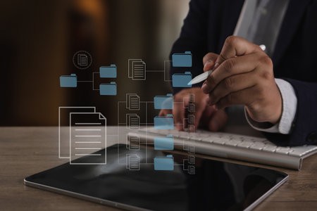An office files report document person business suit organizes digital folders and files tablet with stylus, symbolizing data management and digitalの写真素材