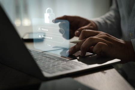 A cybersecurity data privacy person using laptop with digital login interface overlay, showing fields for name and password, modern workspaceの写真素材
