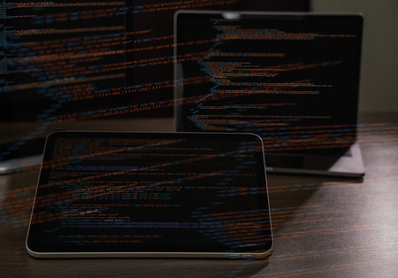 Programmer workspace with source code displayed on multiple devices, concept of software...