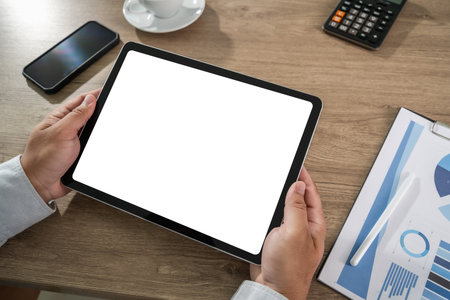 businessman holds a mockup tablet Blank Screen Mockup for UX/Presentation Mockup replaces your...