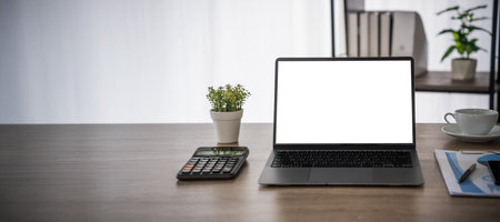 Laptop with blank screen on table. Workspace background new project on laptop computer with blank copy space screen for your advertising text messageの写真素材