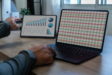analysis data man using a tablet to analysis chart marketing company financial budget report...