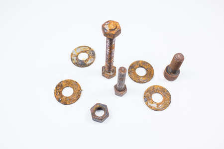Nut and Bolts Rusty Screws on white Background.These old metal parts surface.の写真素材