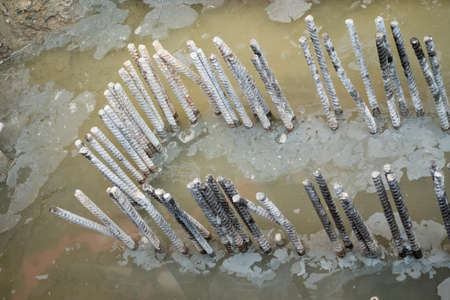 Screw thread steel bar framework in the construction siteの写真素材