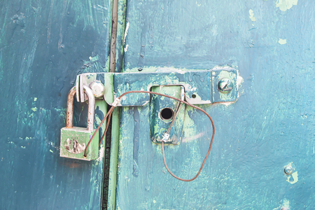 Old lock on the doorの写真素材