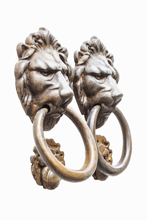 old style lion's head knocker isolated on white backgroundの写真素材